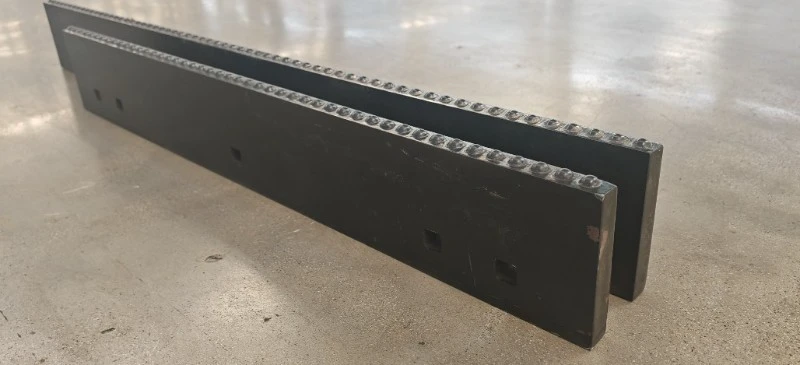 Packed ice carbide kit installed on a municipal plow